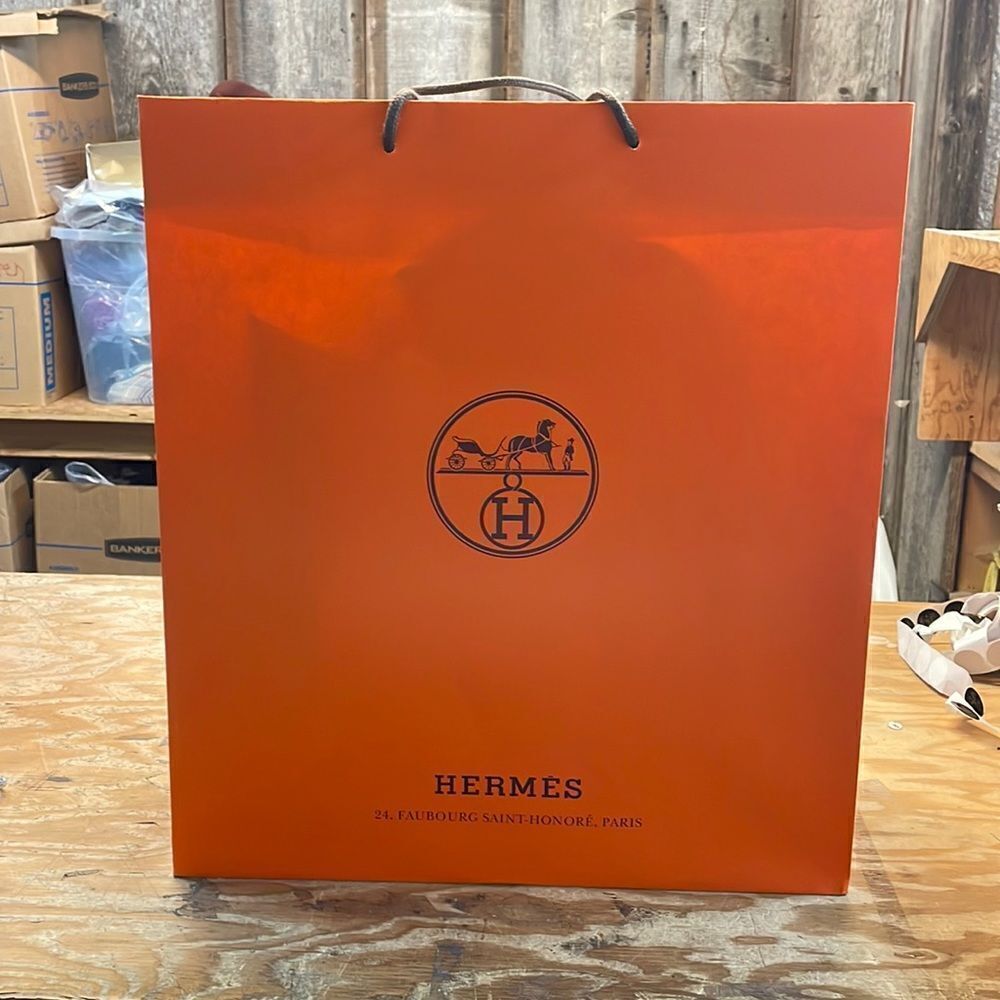 Hermes orange shopping bag. It’s empty